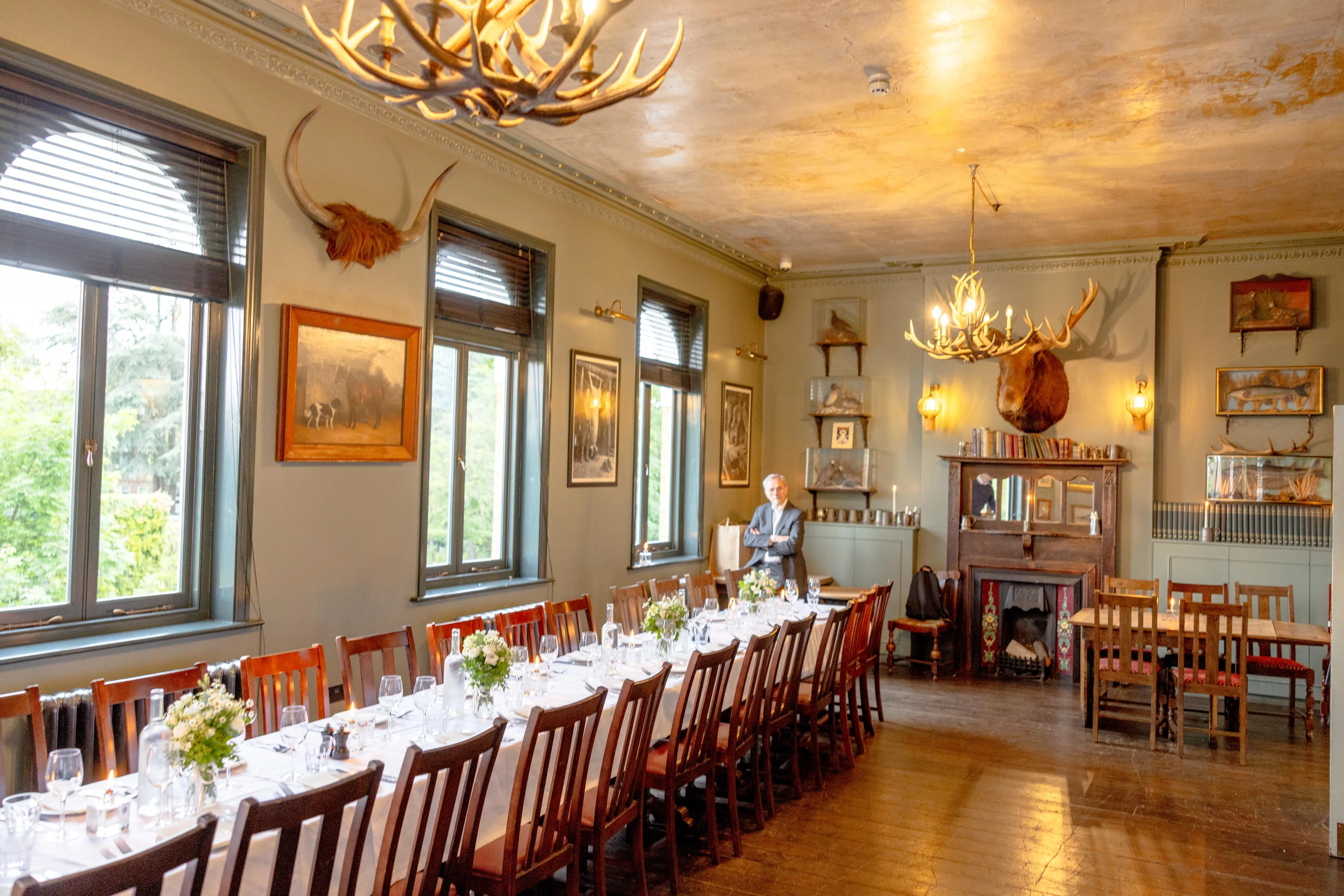 Elegant dining room with long table and decor.